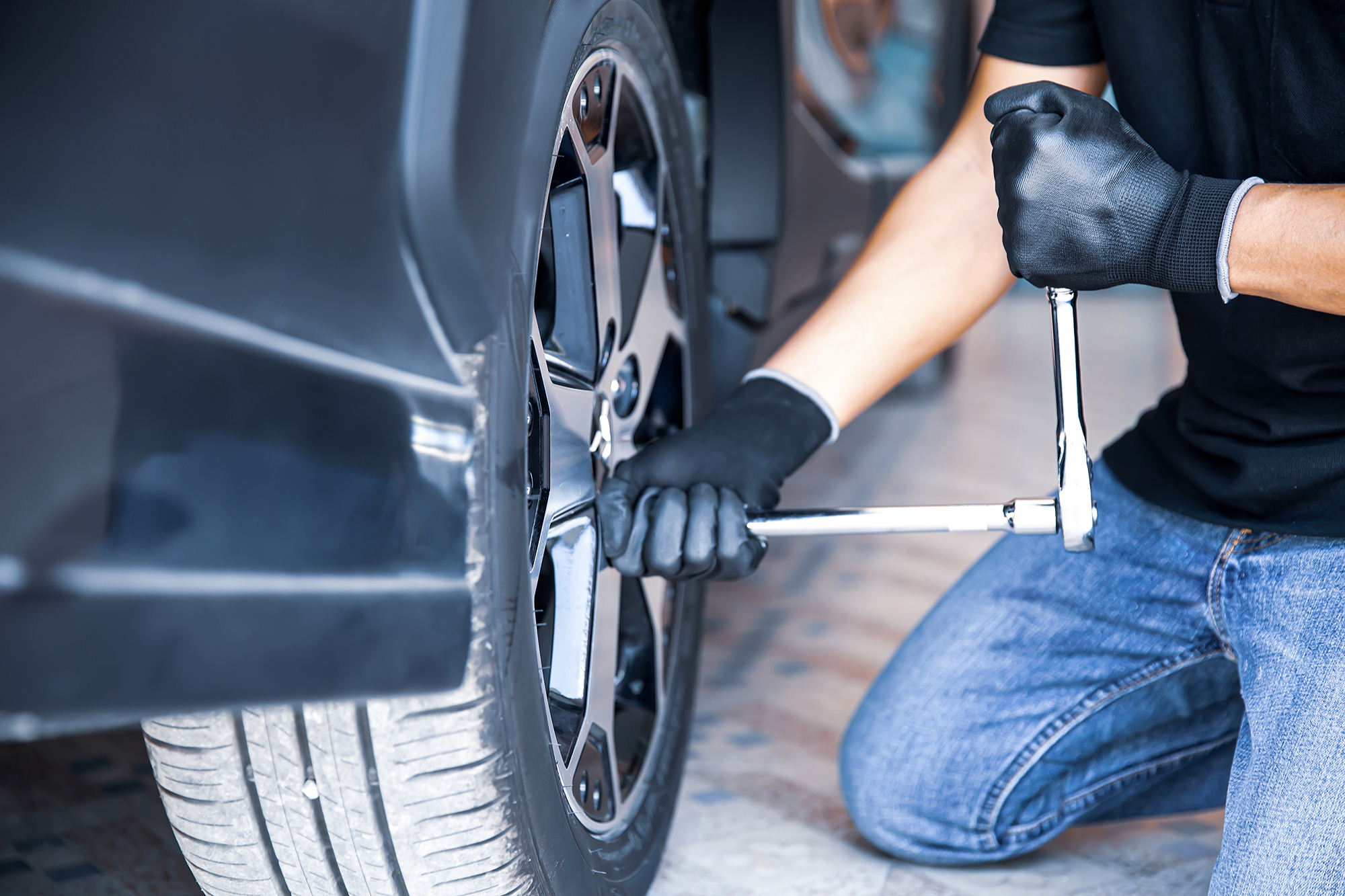 car-mechanic-checking-use-wrench-change-tire-concept-car-care-service-maintenance-safety (1) (1) Tire Installation & Balancing